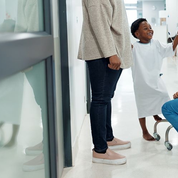 A group of people in the corridor of a hospital